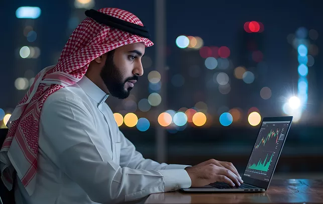 Man using a tablet while sitting at a table